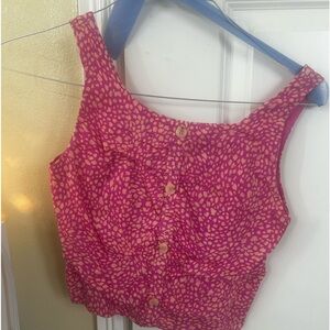 Pink shirt with white dots and buttons down the front